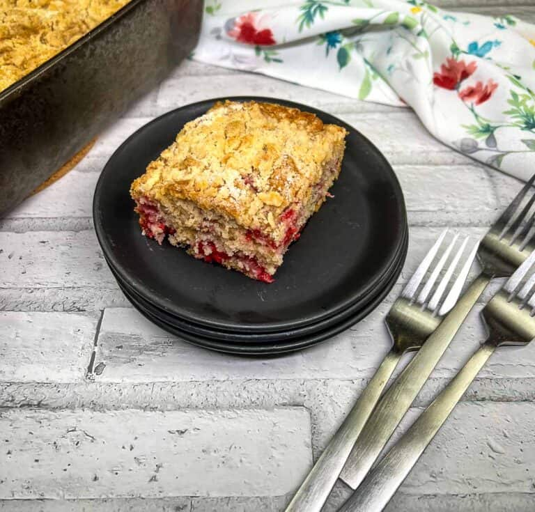 Raspberry Crumb Cake on a black plate.