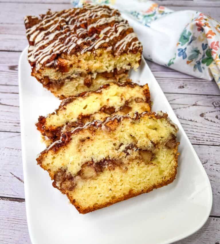 Sliced Apple Fritter Bread on a white plate.