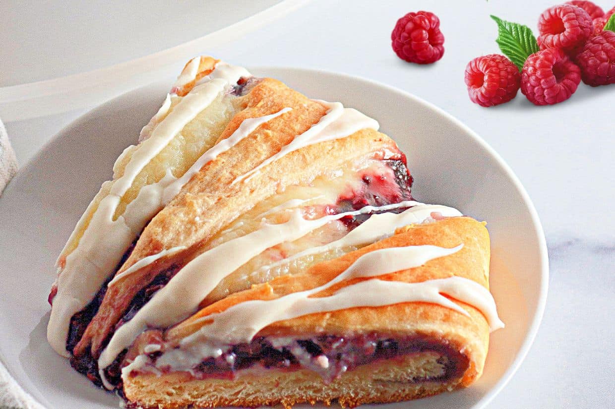 Raspberry Crescent Ring with golden flaky crust and sweet raspberry filling.