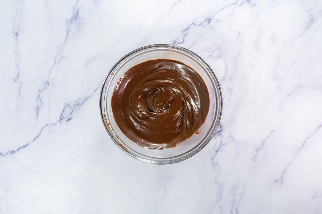 Melt chocolate chips in a microwave-safe bowl.