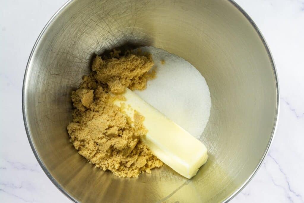 Cream the softened butter, granulated sugar, and brown sugar.