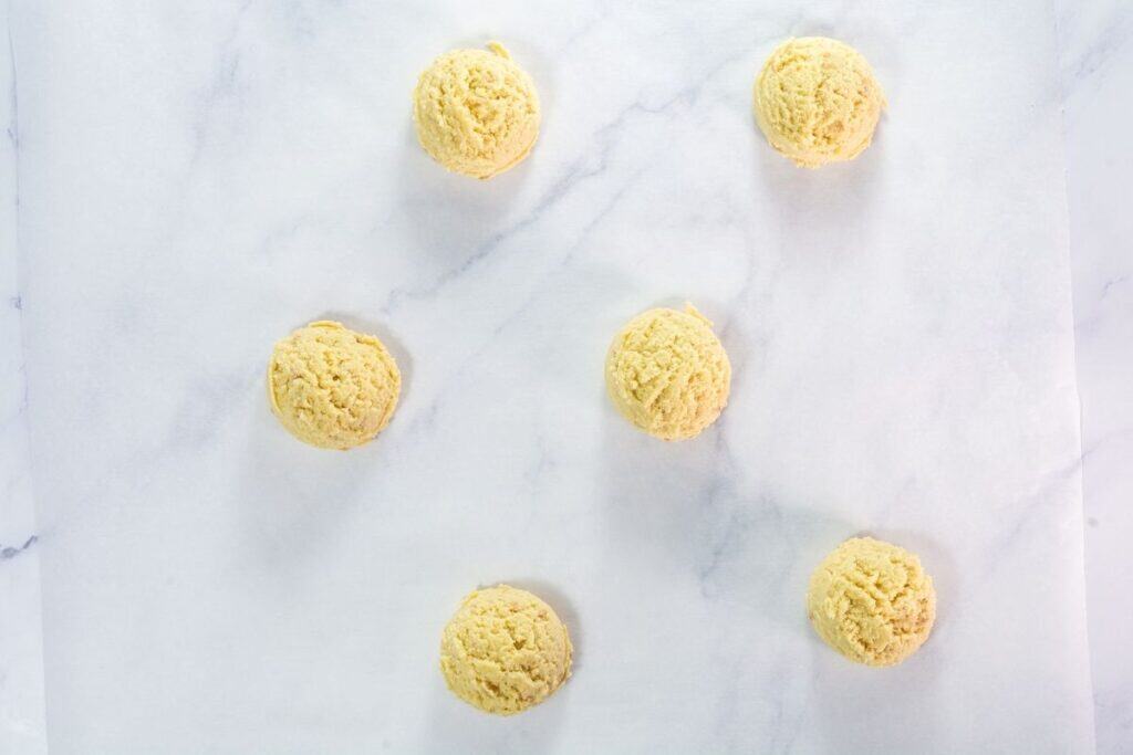 Use a large cookie scoop to portion dough onto prepared baking sheets.