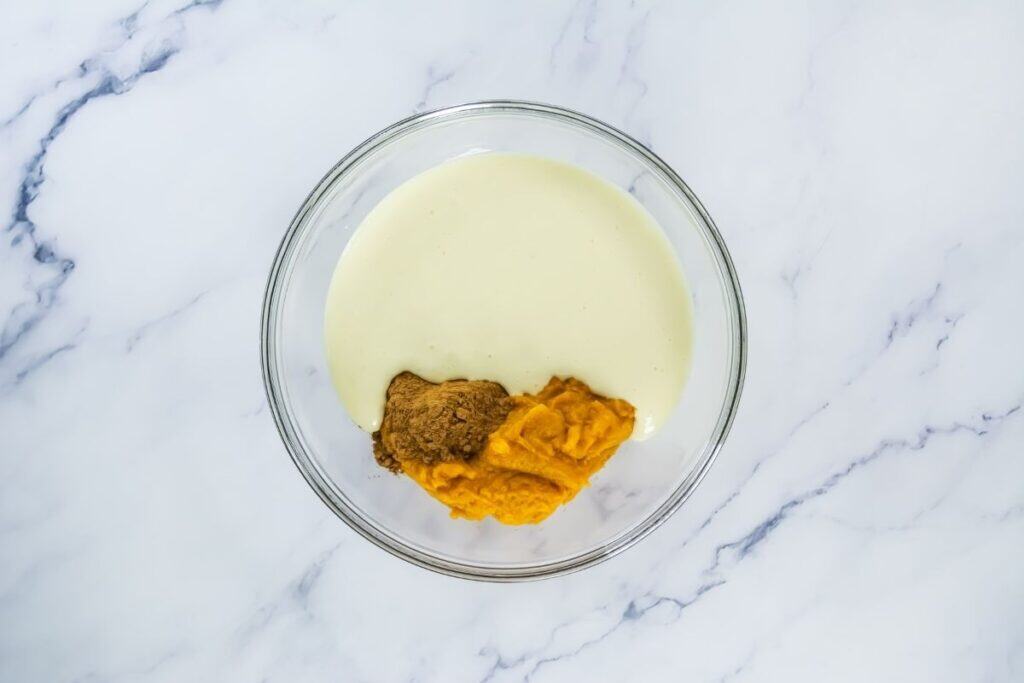 Half of the cheesecake batter into a medium bowl and whisk in the pumpkin puree and pumpkin pie spice.