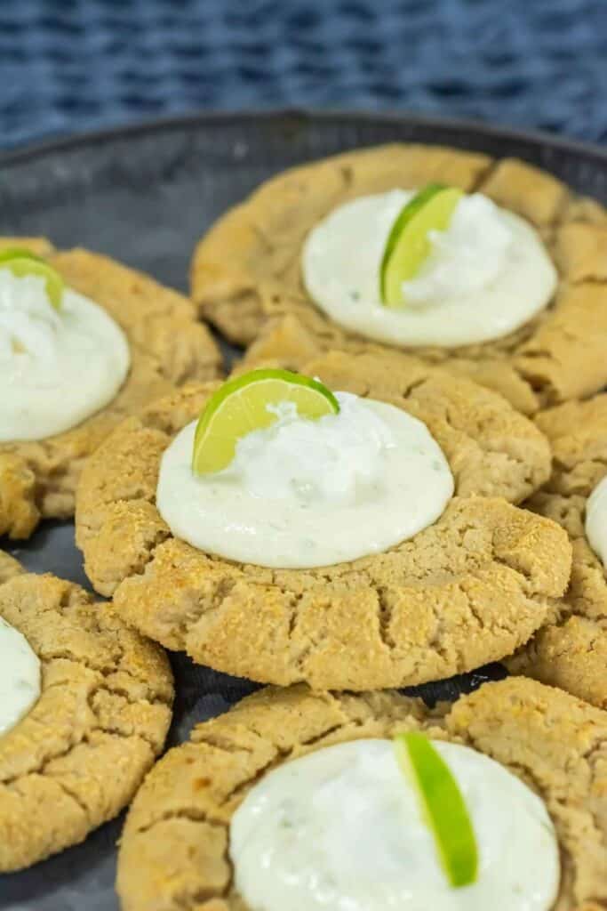 Lemon-lime cookies topped with creamy lime frosting, perfect for baking lovers.