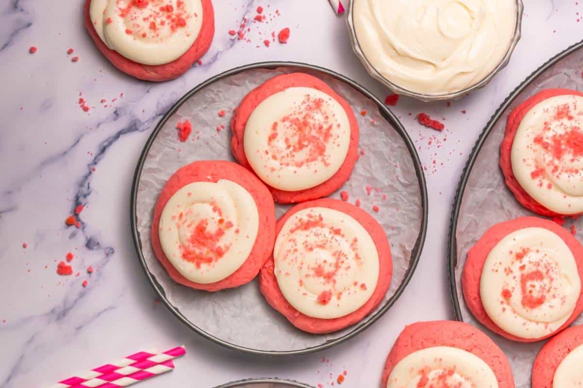 Soft pink velvet cookies topped with cream cheese frosting.