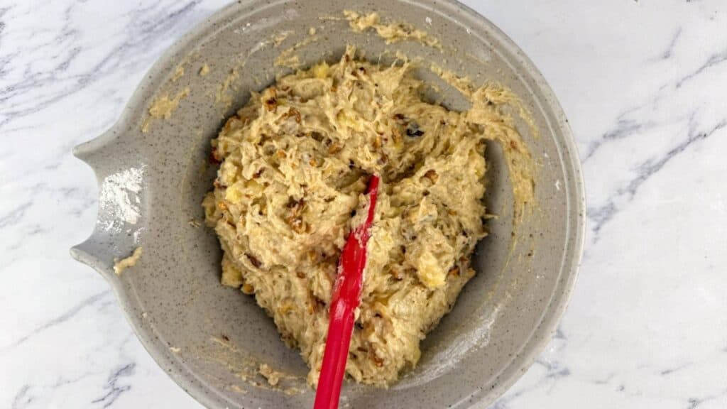 Add the dry ingredients to the banana mixture and stir gently.
