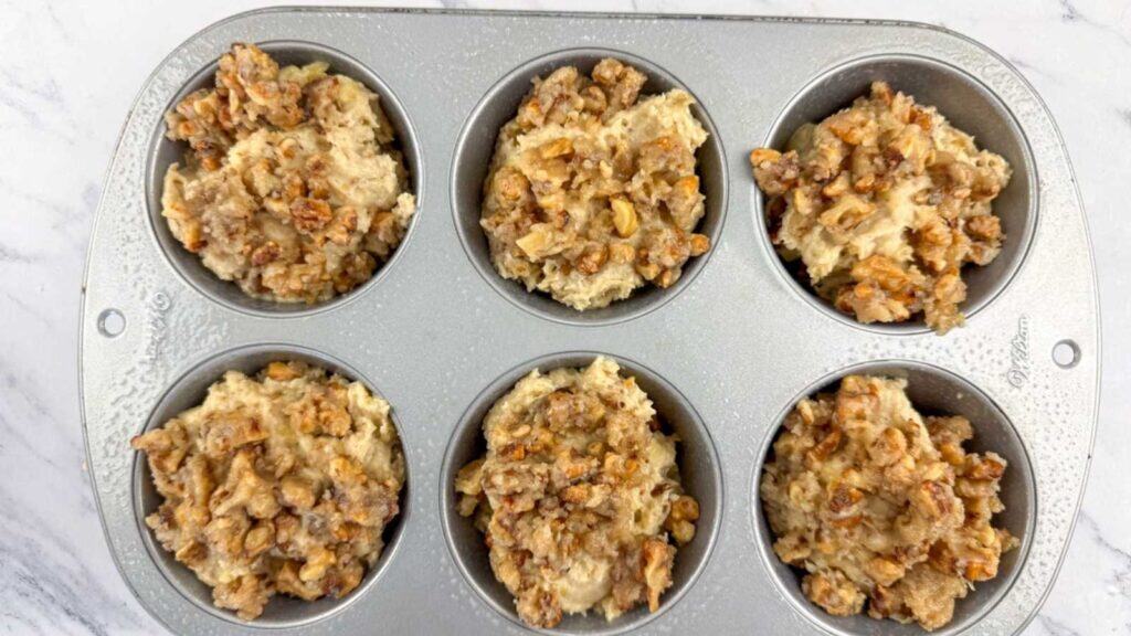 Sprinkle the crumb topping evenly over each muffin.